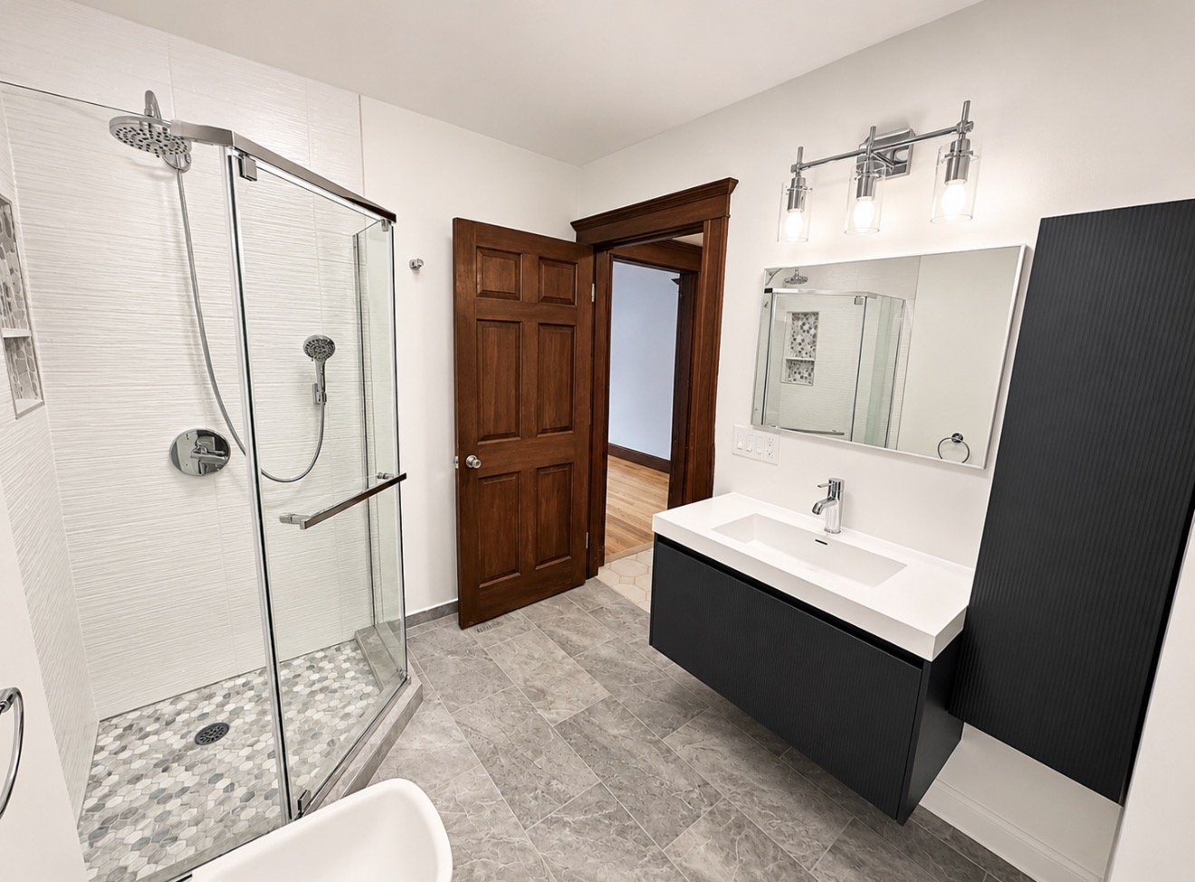 Corner shower & floating vanity