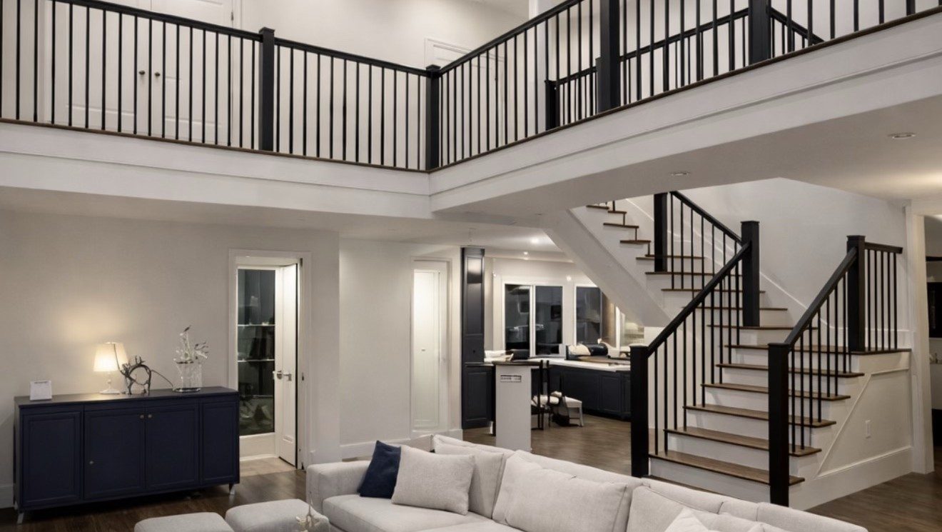 Living room with mezzanine and black railings